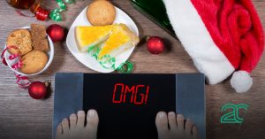scale showing "OMG" instead of weight demonstrating overeating on Christmas